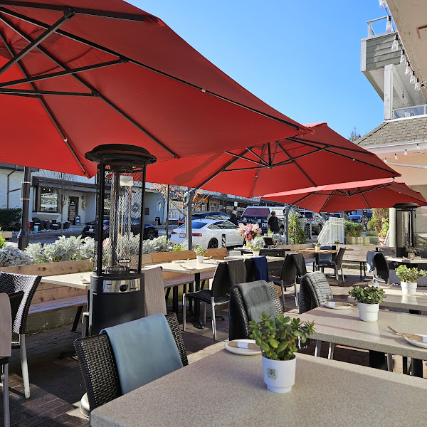 Arms Reach Bistro patio with red umbrellas