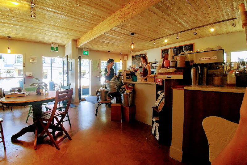 Caf/EH café interior with wood ceiling and espresso bar